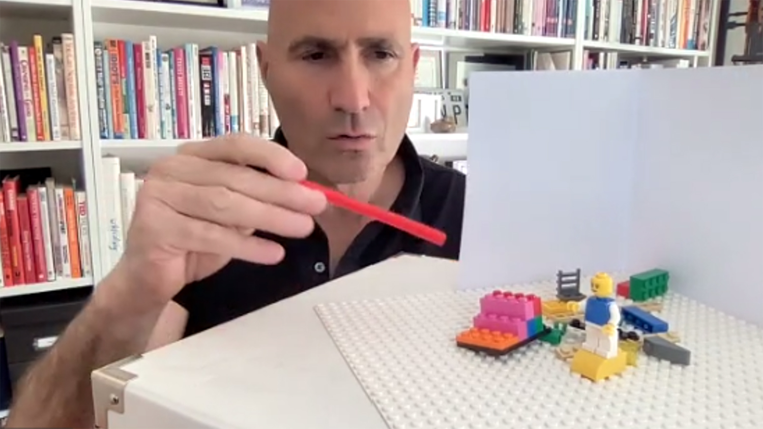 man constructing with Lego