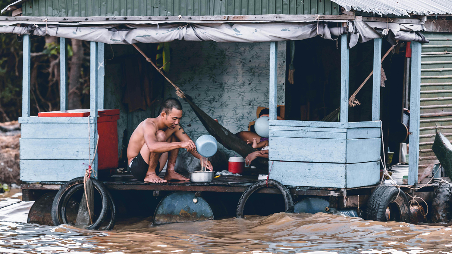 man surviving in flood