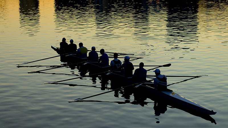 rowing crew on a river